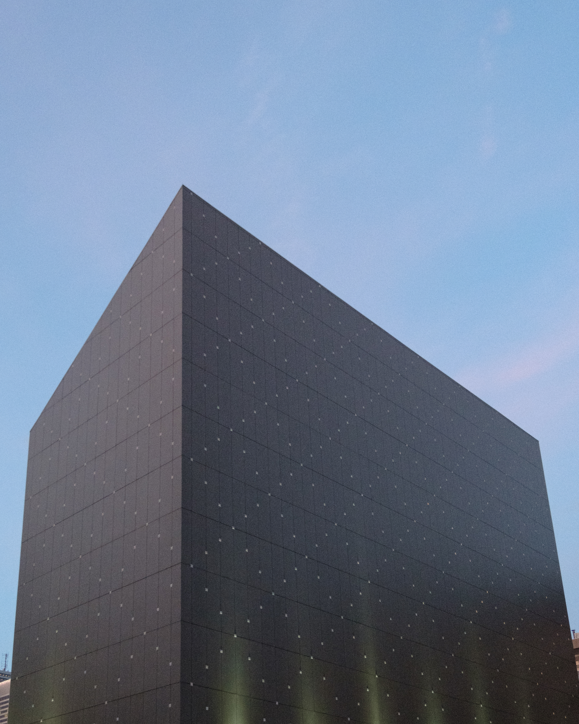 Modern Black Building with Blue Sky