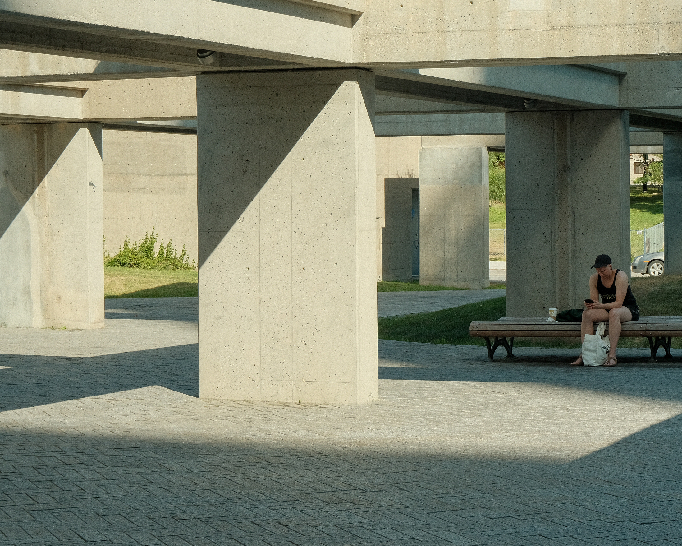 Person Sitting on Bench with Phone
